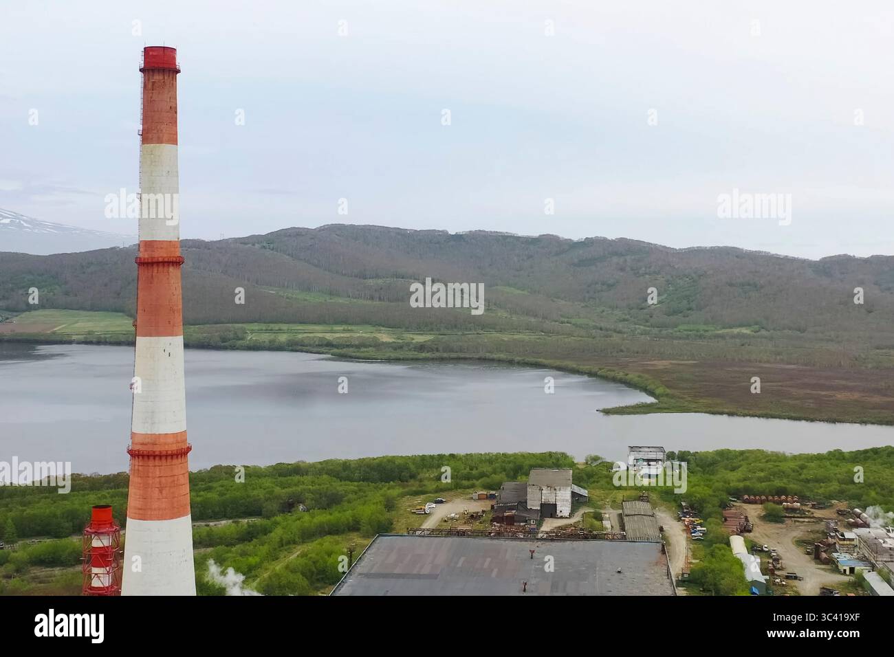 The chimney of old city heating boiler house. Stock Photo