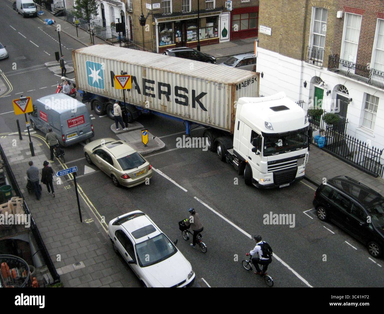 A lorry negotiating a narrow residential street in London W1 - October 2011 Stock Photo