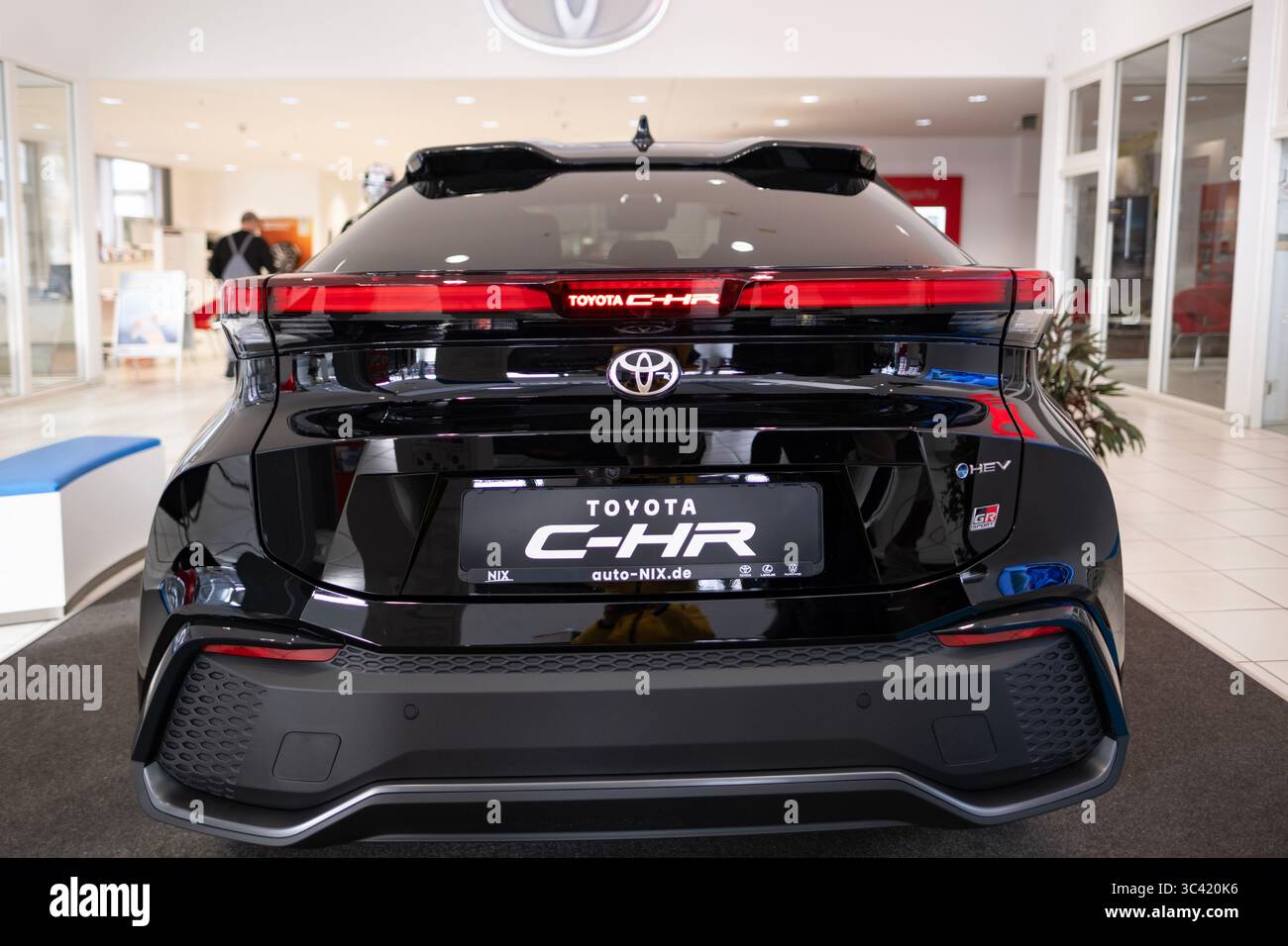 black Toyota C-HR HEV GR Sport with LED light bar and sporty rear ...