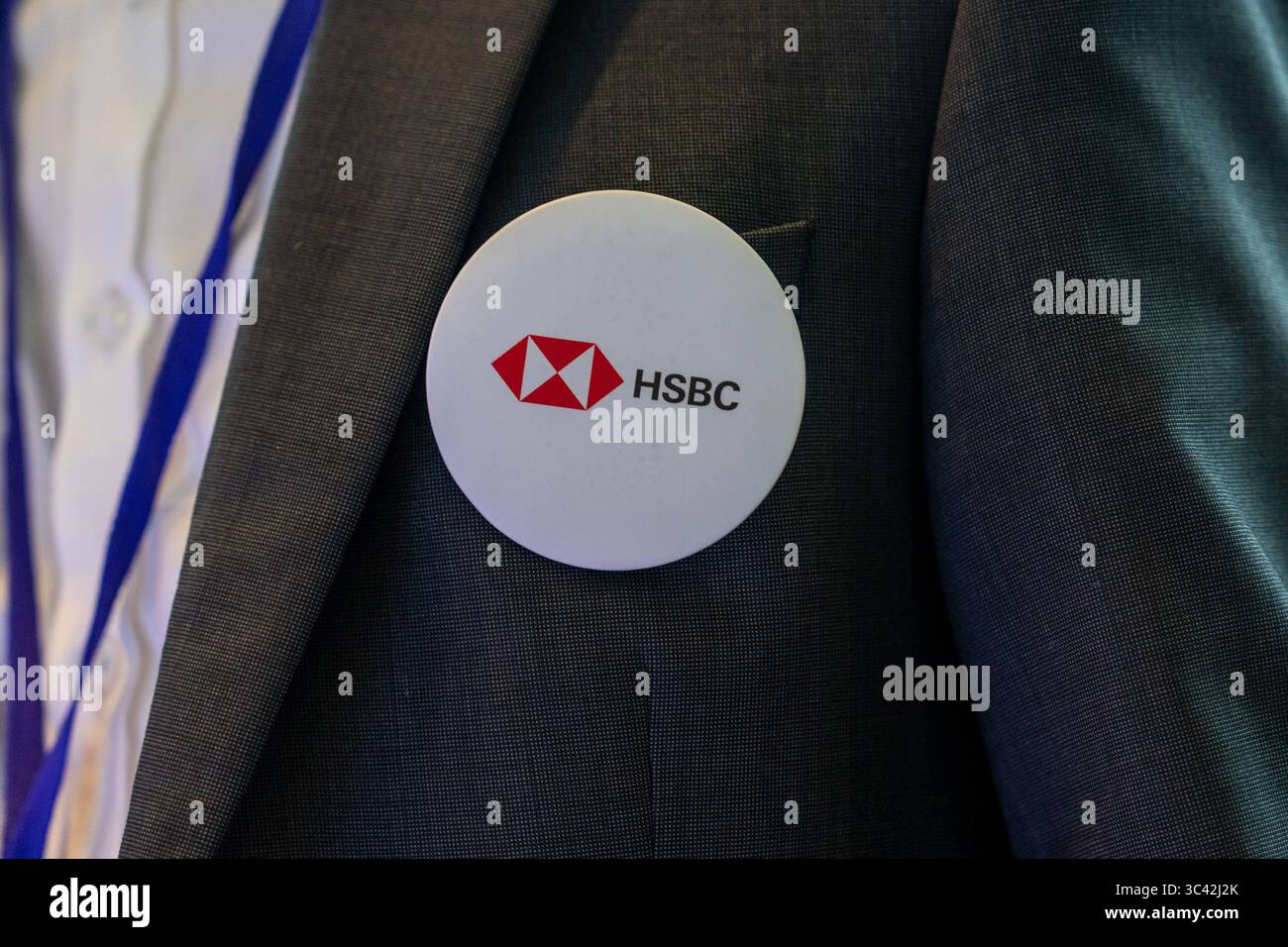 Hong Kong Data Summit 2025 A worker wearing a badge with the HSBC logo ...