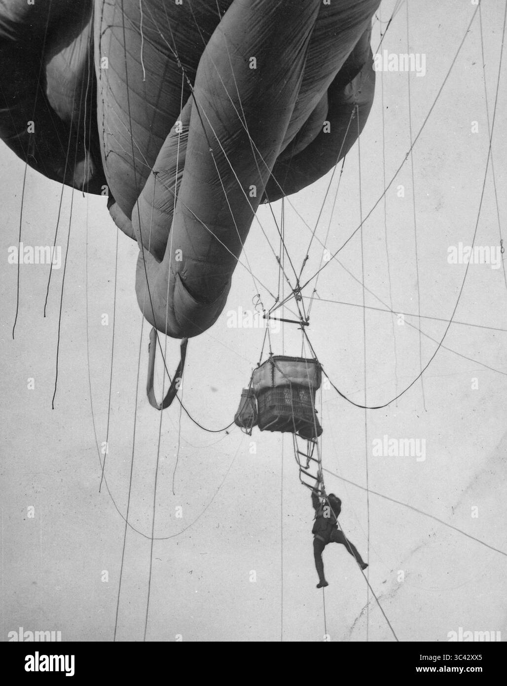 Returning from a U-Boat scouting party. Aerial naval observer coming down from a 'Blimp' type balloon after a scouting tour somewhere on the Atlantic Coast. 1918 Stock Photo
