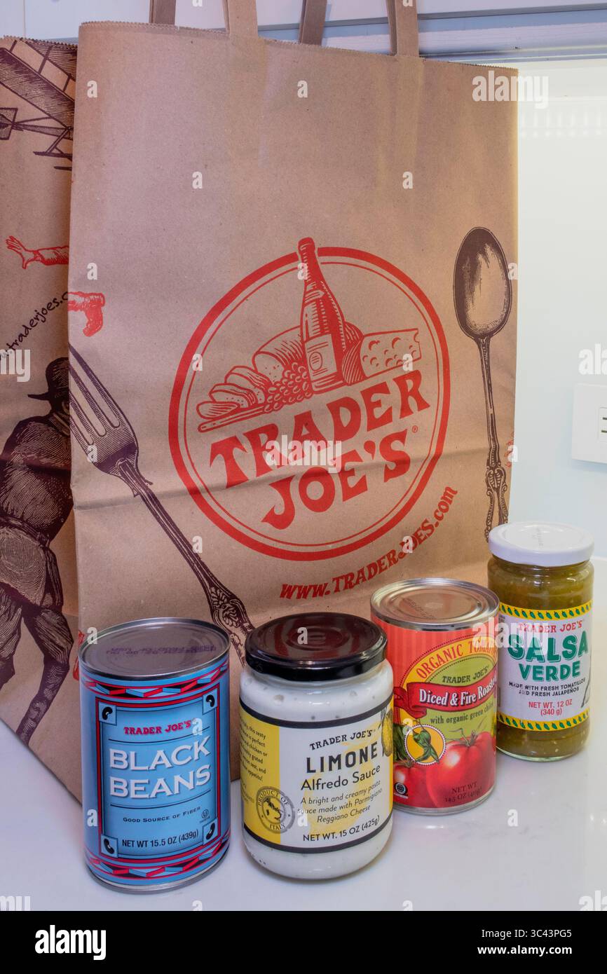 Kitchen counter with store brand products and Trader Joe's shopping bag,  USA  2025 Stock Photo