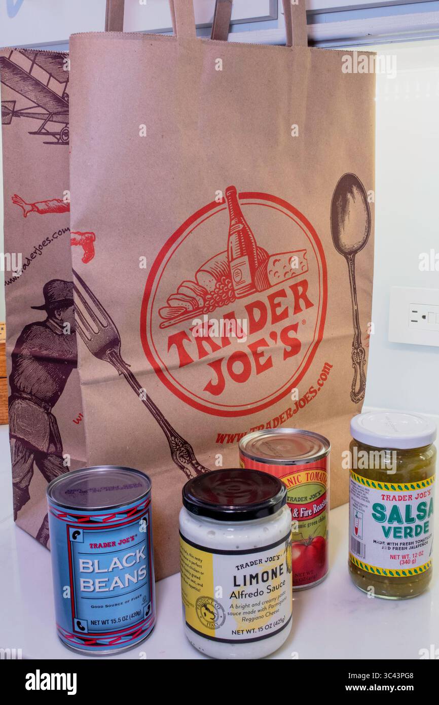 Kitchen counter with store brand products and Trader Joe's shopping bag,  USA  2025 Stock Photo