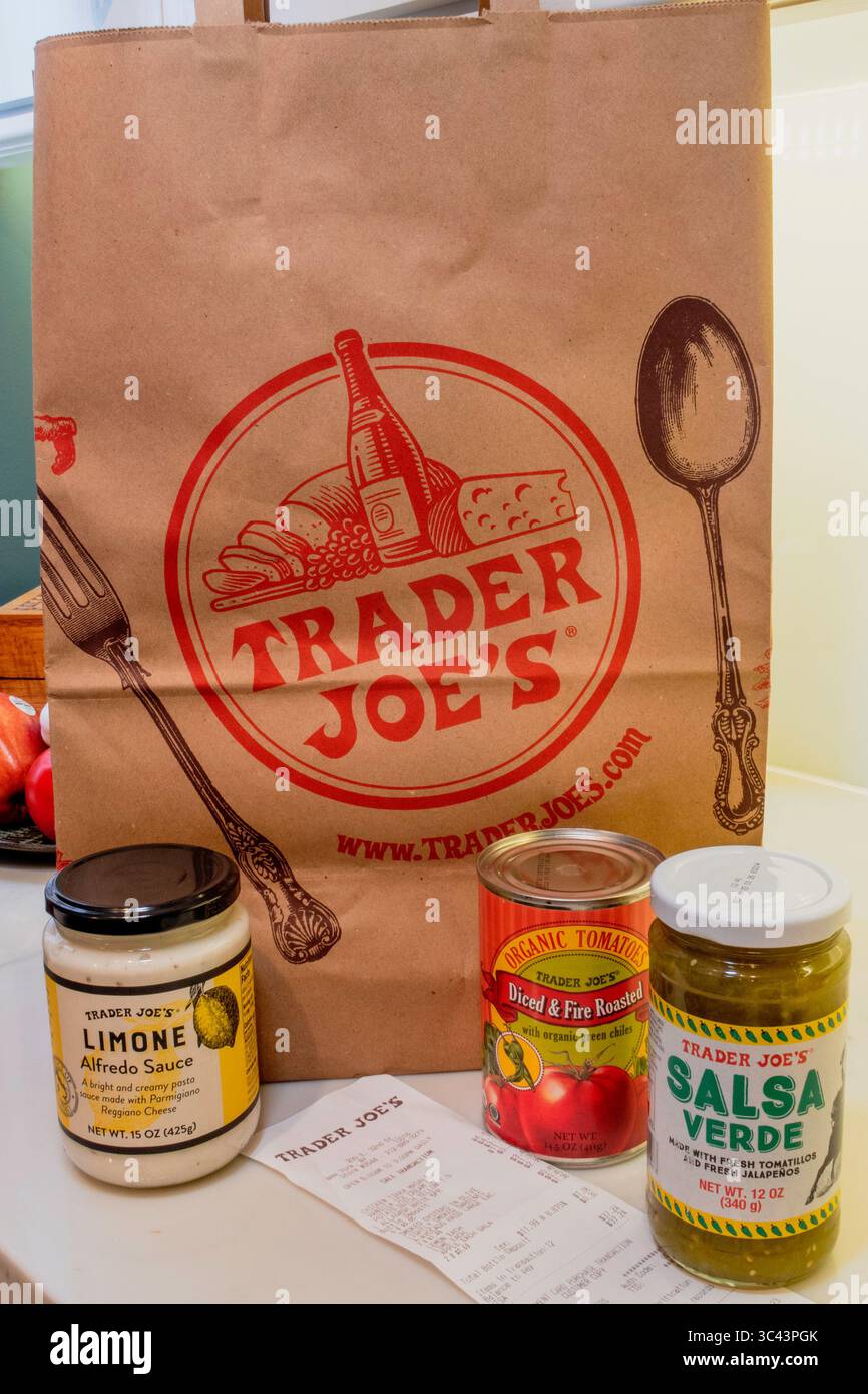 Kitchen counter with store brand products and Trader Joe's shopping bag,  USA  2025 Stock Photo