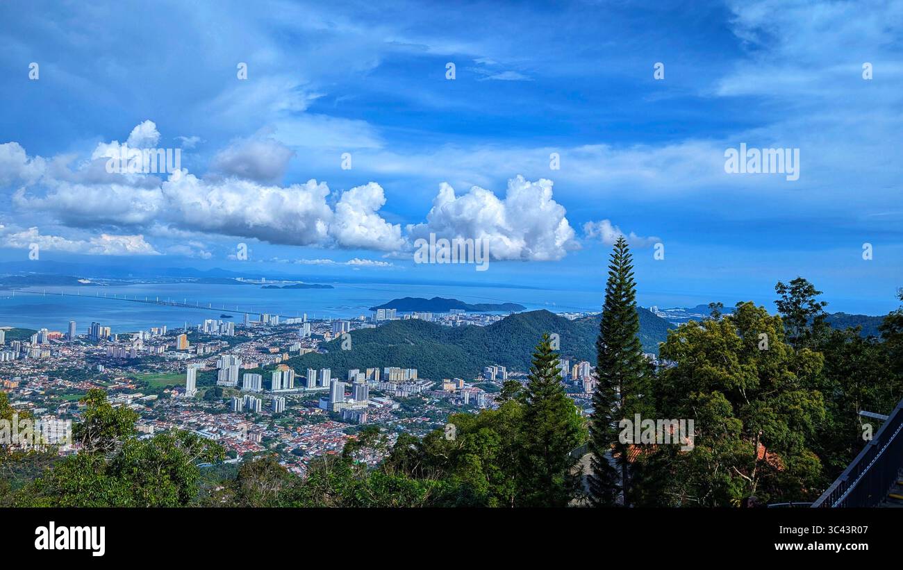 breathtaking sunset photography scene unfolds at Batu Caves Malaysia, where a golden hour sky meets urban tower lights and road night lighting. From - Smartphone Captured Stock Image