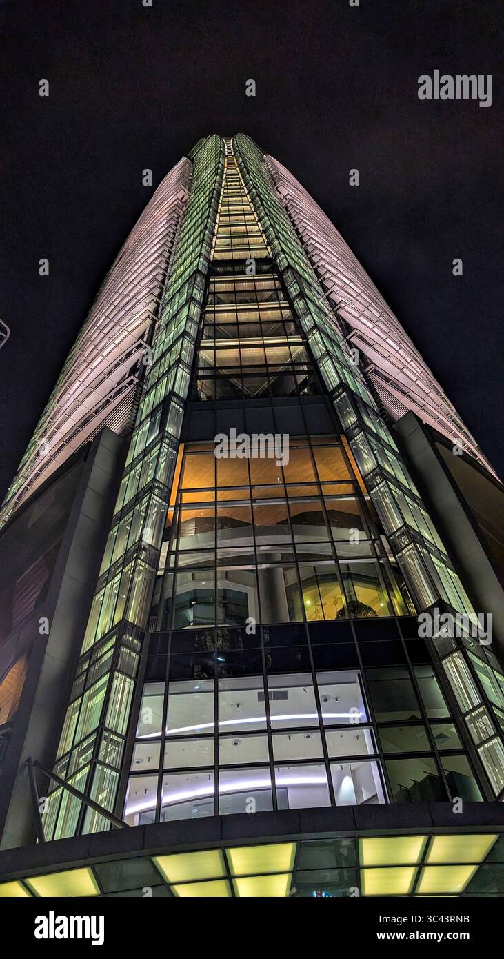 breathtaking sunset photography scene unfolds at Batu Caves Malaysia, where a golden hour sky meets urban tower lights and road night lighting. From - Smartphone Captured Stock Image