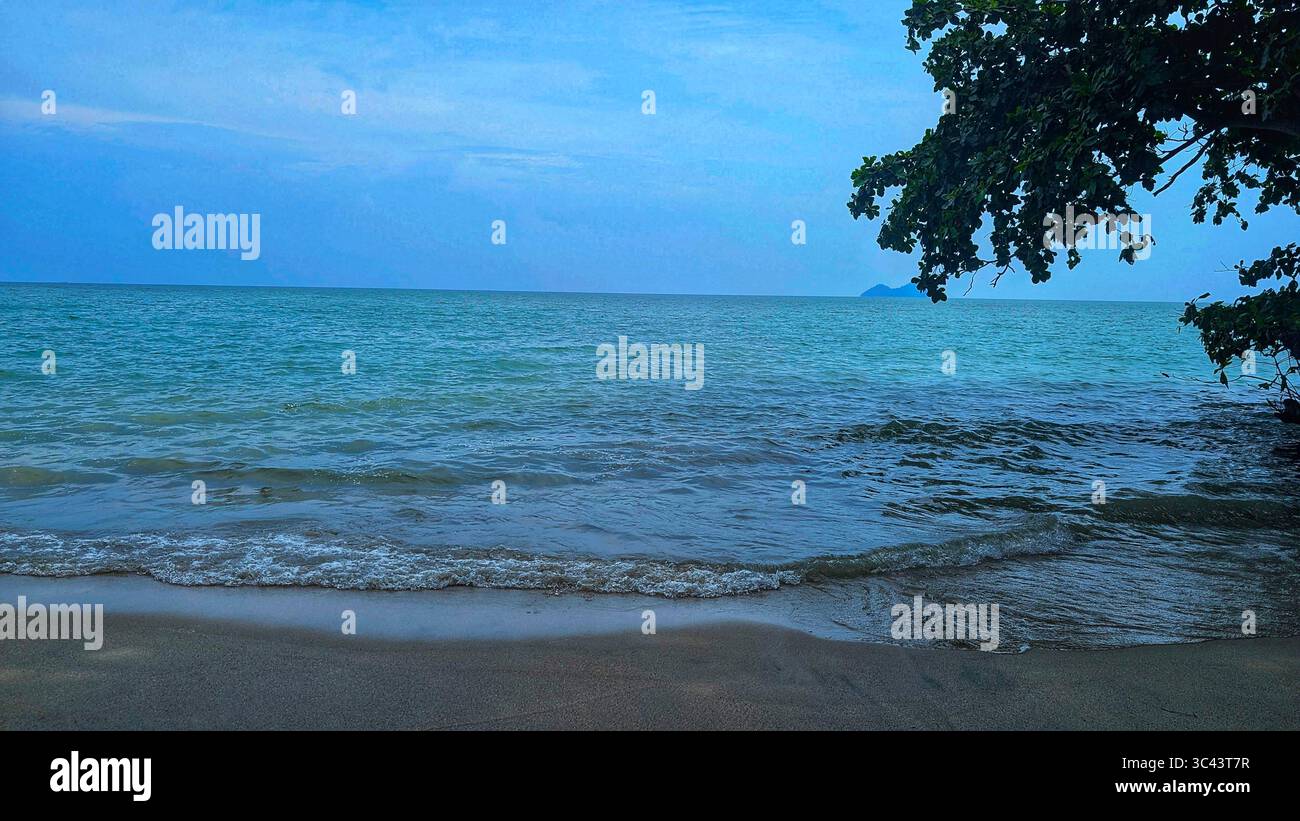 breathtaking sunset photography scene unfolds at Batu Caves Malaysia, where a golden hour sky meets urban tower lights and road night lighting. From - Smartphone Captured Stock Image