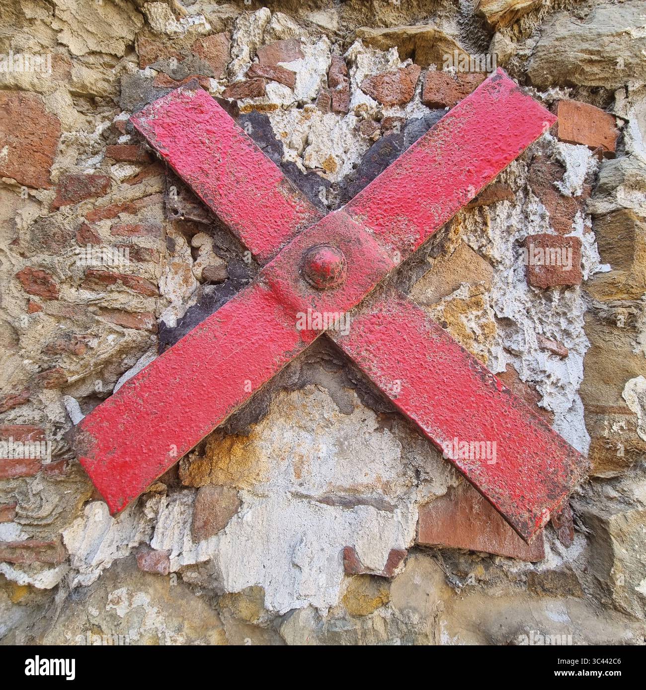 Red Cross on a Stone Wall in Tangier Morocco - Smartphone Captured Stock Image