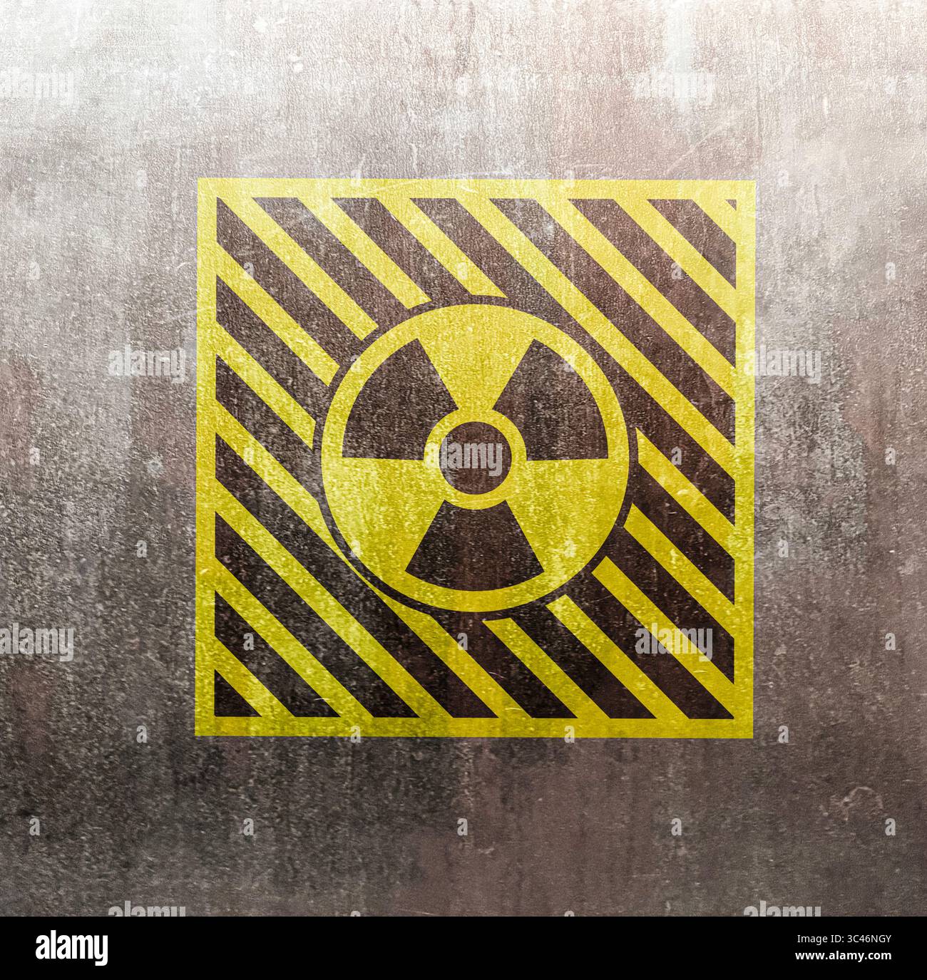 Radioactive sign on grey textured surface. Radiological pollution Stock Photo