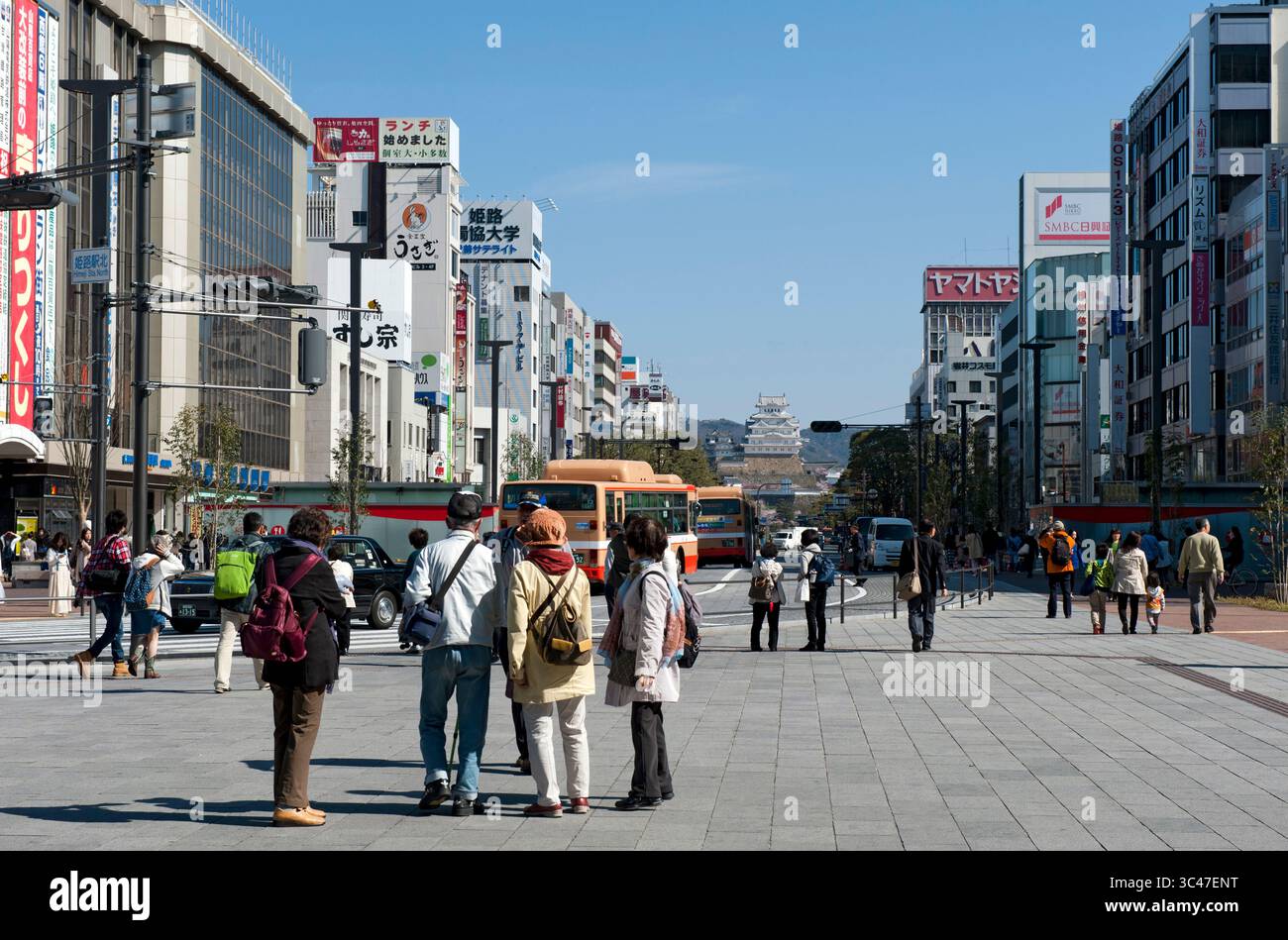 View from Himeji JR train station down city's main Otemae-dori (Otemae Street) of the UNESCO World Heritage Site of Himeji Castle (姫路城), Hyogo, Japan. Stock Photo