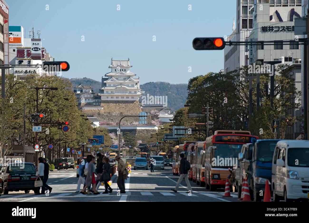 View from Himeji JR train station down city's main Otemae-dori (Otemae Street) of the UNESCO World Heritage Site of Himeji Castle (姫路城), Hyogo, Japan. Stock Photo