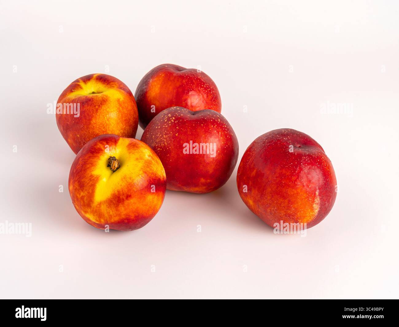 Fresh ripe nectarines on white background, grouped Stock Photo