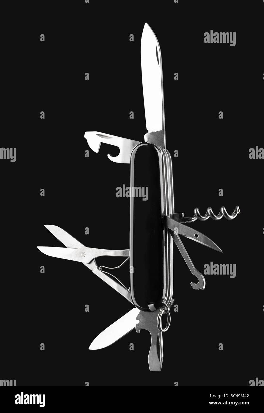Multifunction army pocket folding knife isolated on black background Stock Photo