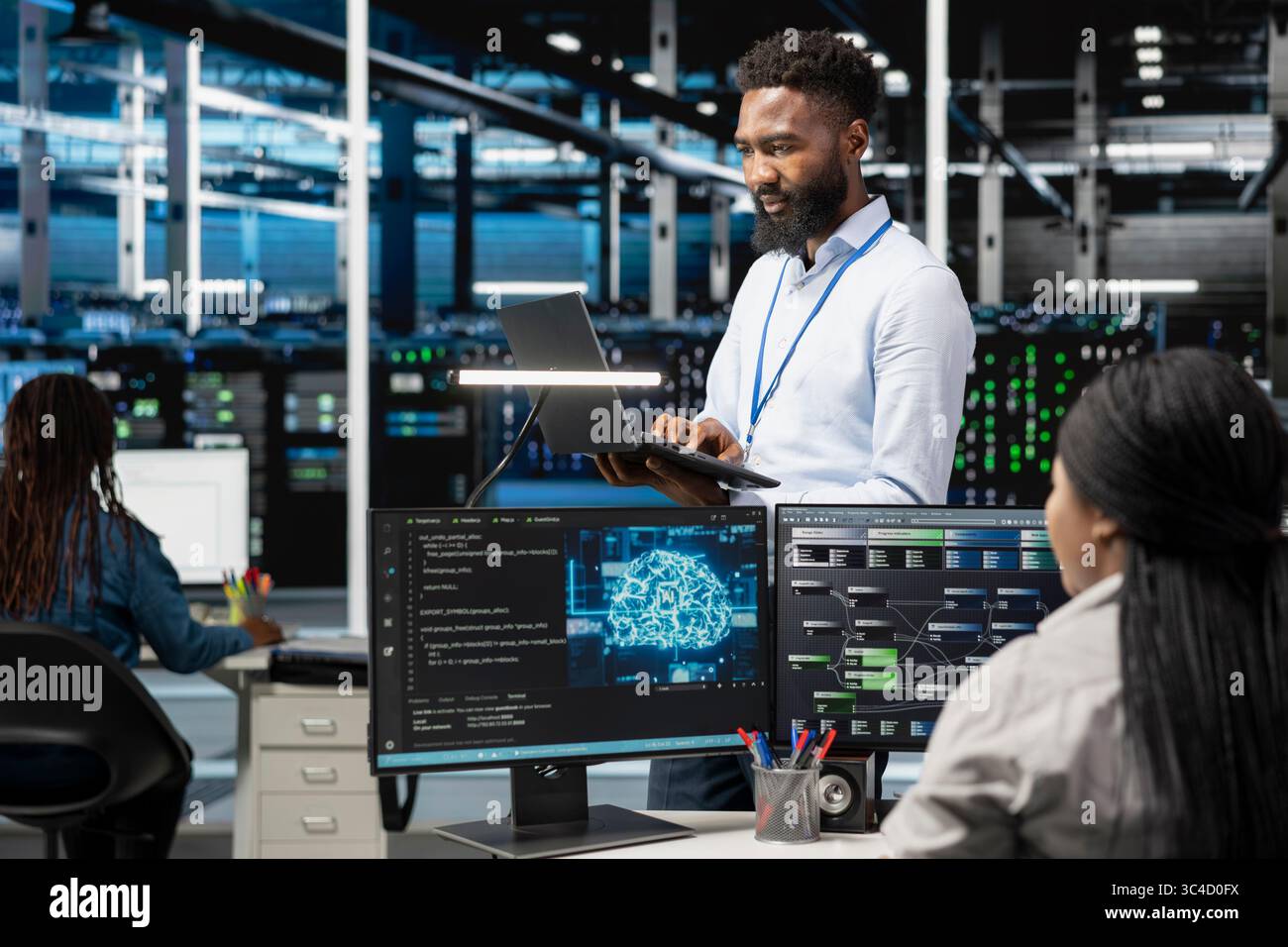 Data center programmer using artificial intelligence neural networks technology. African american man working in server farm using AI programming language on computer, configuring specialized hardware Stock Photo