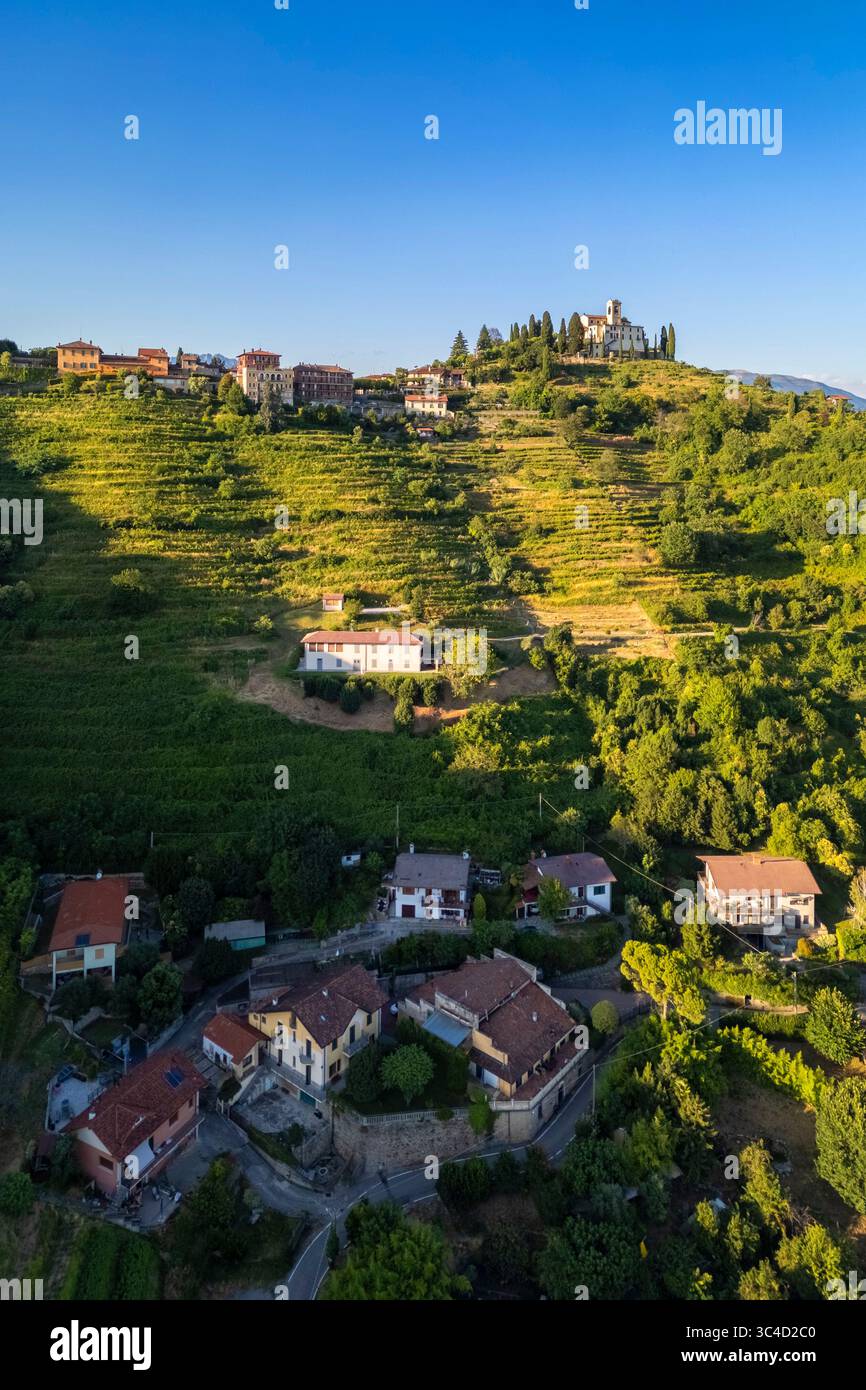 View of Santuario della Beata Vergine del Carmelo at the top of a hill at sunset in summer. Montevecchia, Lecco district, Lombardy, Italy. Stock Photo