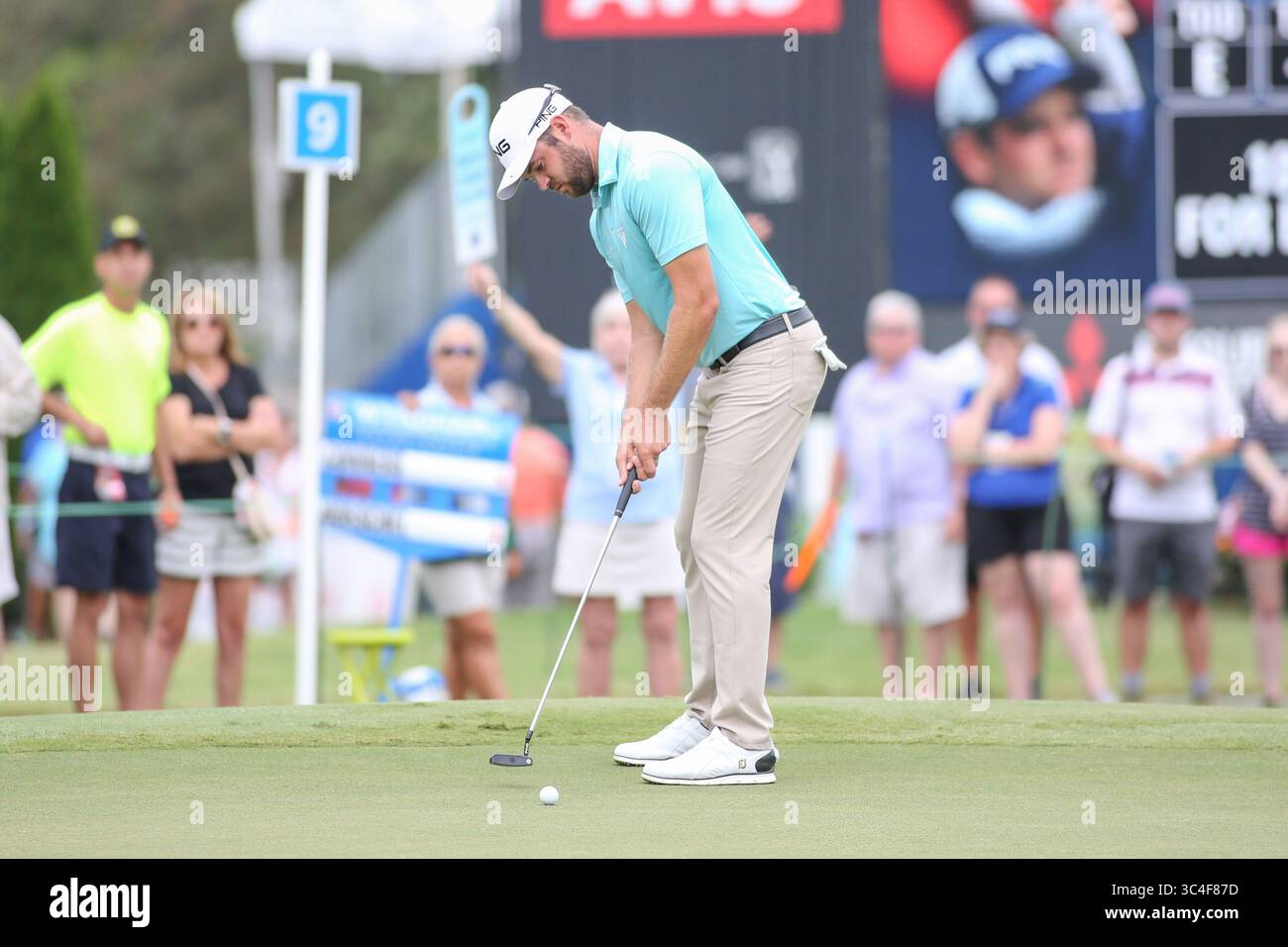August 18, 2018: Corey Conners putts for birdie on the 9th green during the third round of the Wyndham Championship at Sedgefield Country Club in Greensboro, NC. Jonathan Huff/CSM(Credit Image: &copy; Jonathan Huff/CSM via ZUMA Wire) Stock Photo