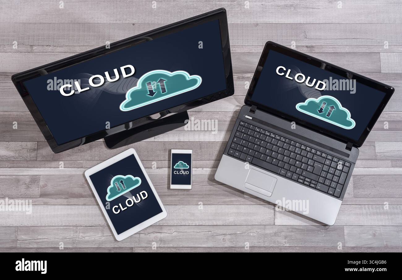 Cloud concept shown on different information technology devices Stock Photo
