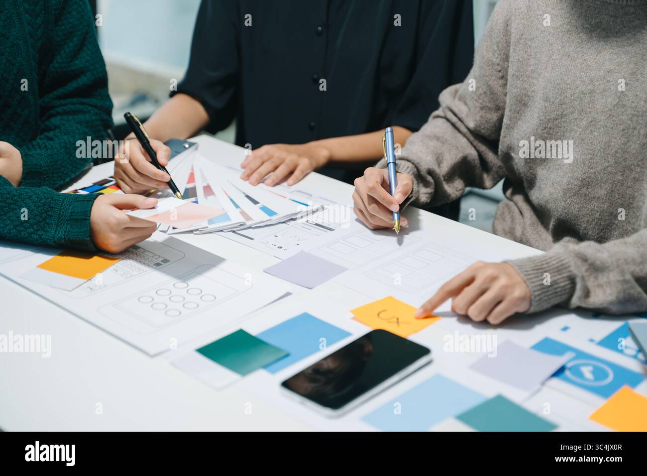 UX graphic designer planning application process development prototype wireframe for web smart phone. Creative digital development agency. Stock Photo