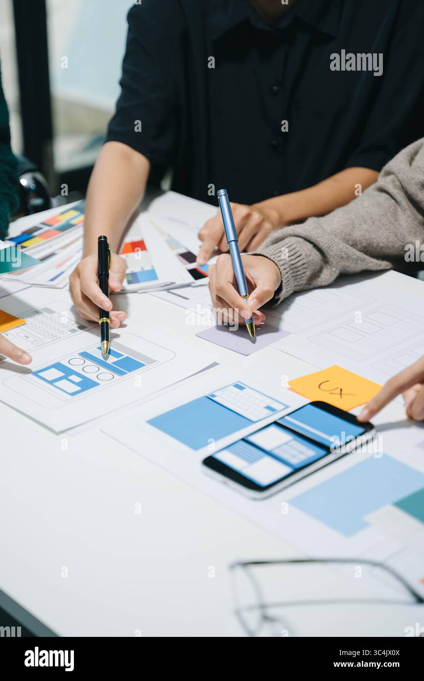 UX graphic designer planning application process development prototype wireframe for web smart phone. Creative digital development agency. Stock Photo