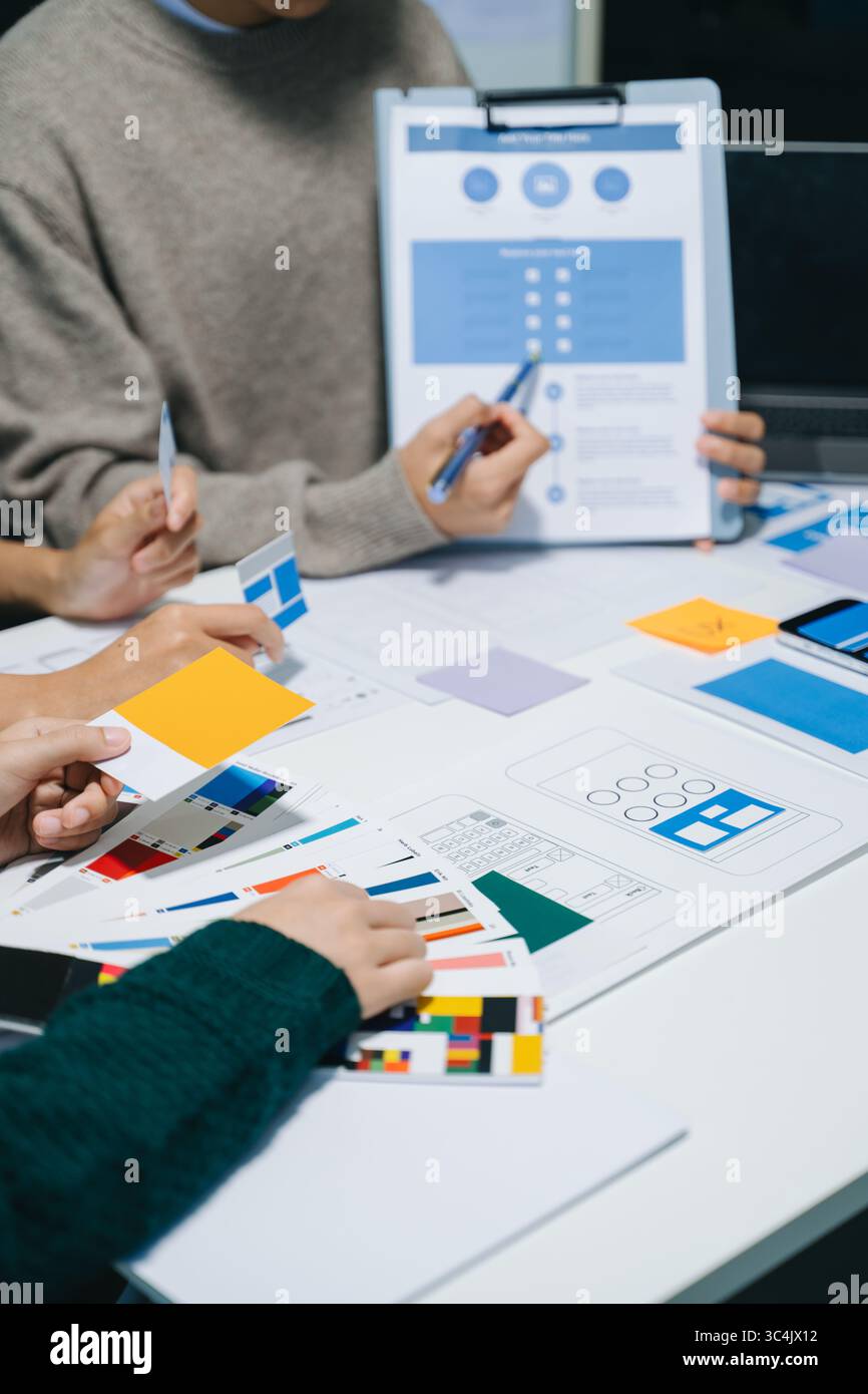 UX graphic designer planning application process development prototype wireframe for web smart phone. Creative digital development agency. Stock Photo