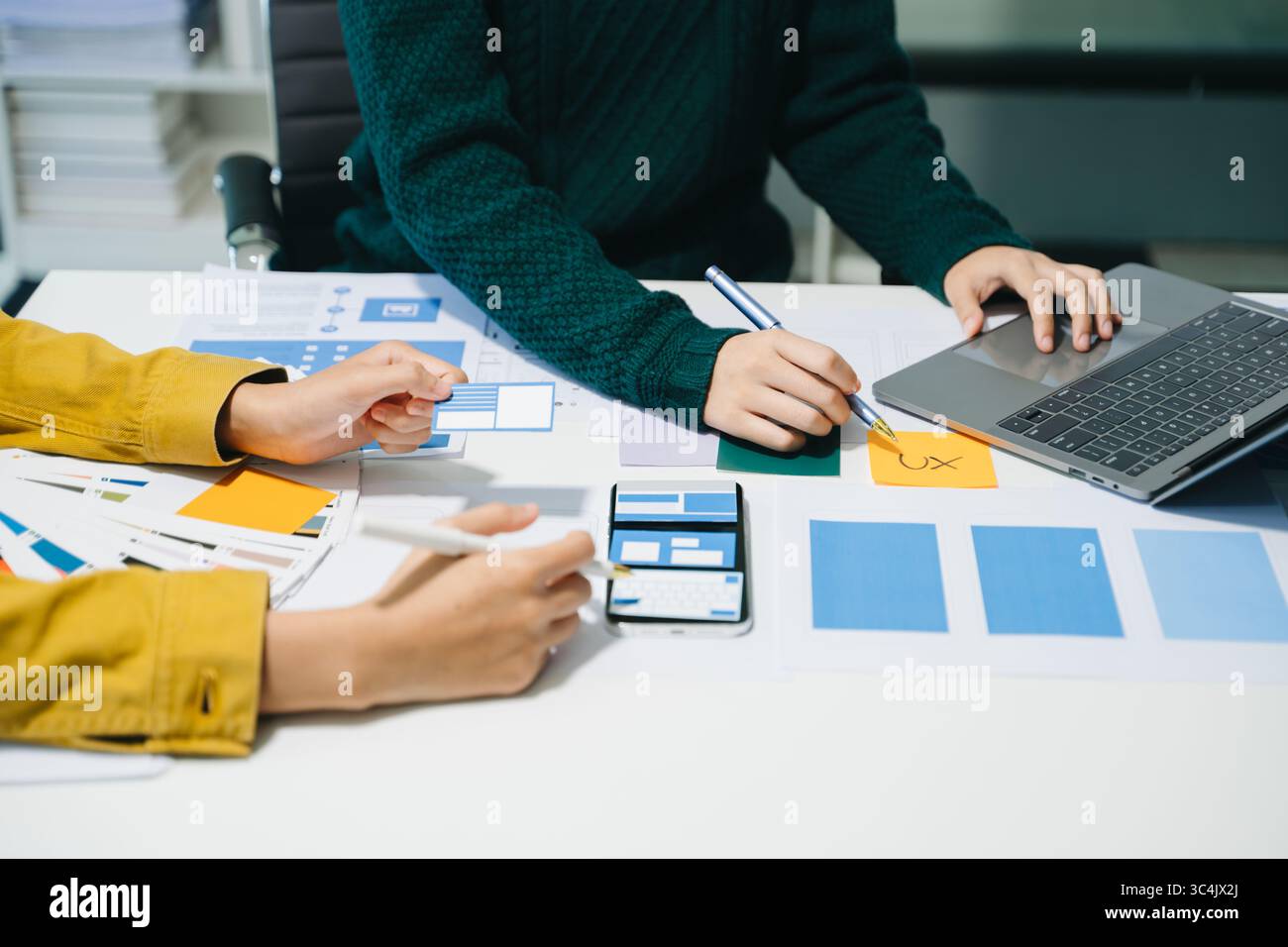 UX graphic designer planning application process development prototype wireframe for web smart phone. Creative digital development agency. Stock Photo