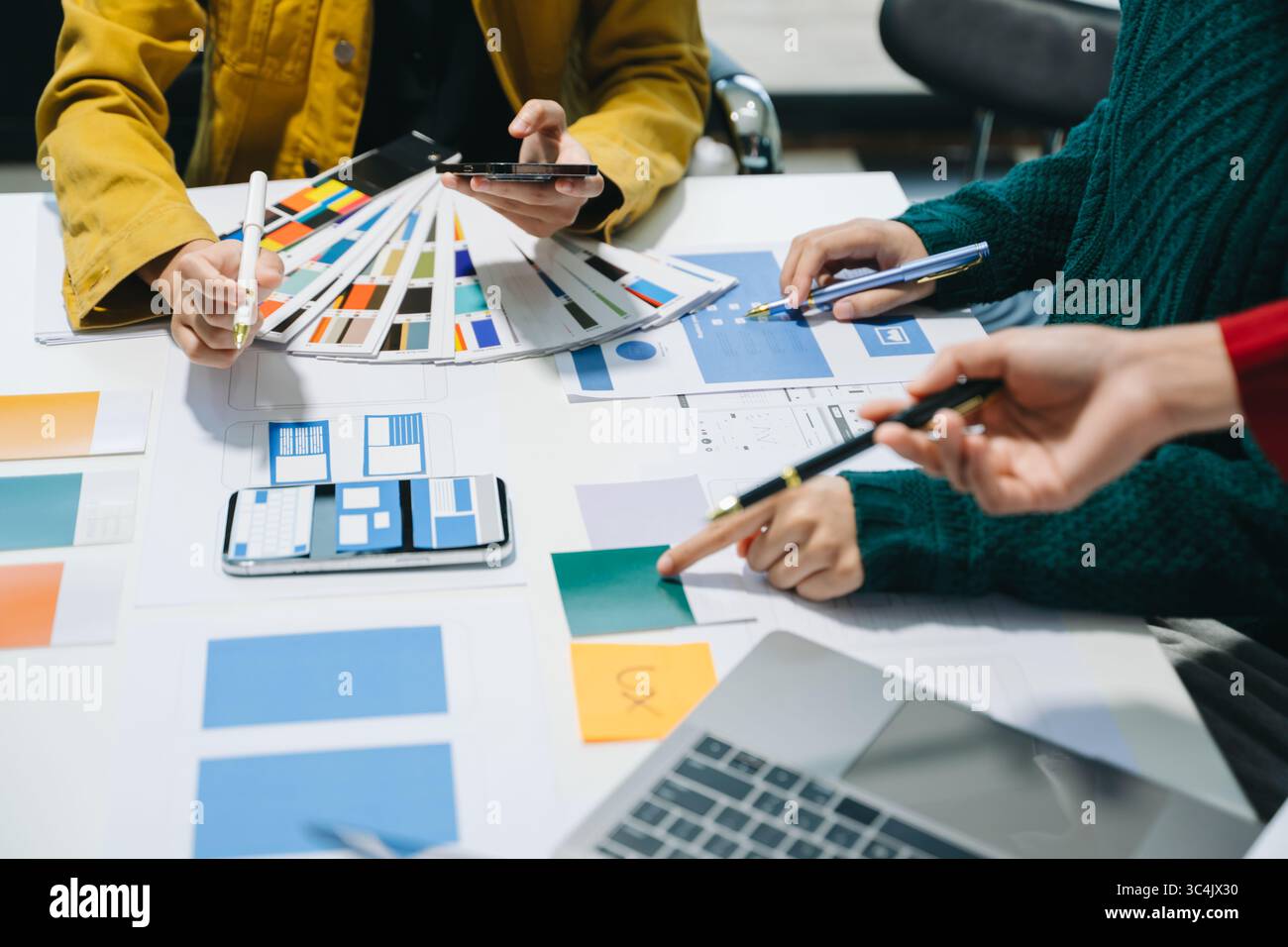 UX graphic designer planning application process development prototype wireframe for web smart phone. Creative digital development agency. Stock Photo