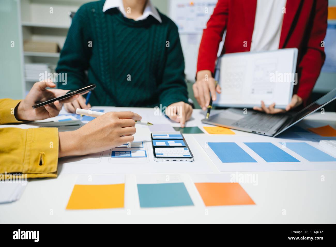 UX graphic designer planning application process development prototype wireframe for web smart phone. Creative digital development agency. Stock Photo