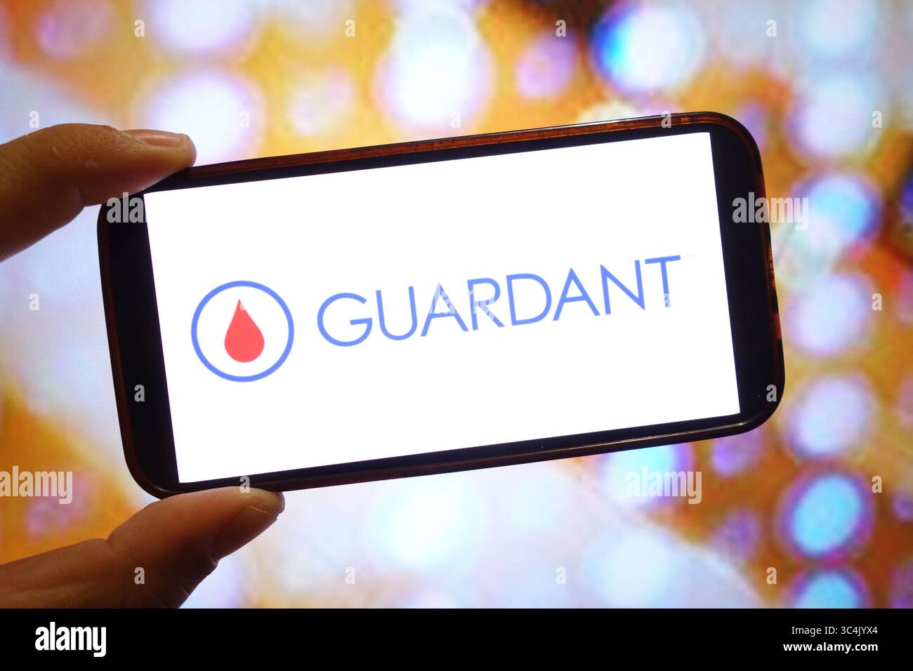 In this photo illustration a Guardant Health, Inc. logo is seen displayed  on a smartphone Stock Photo - Alamy