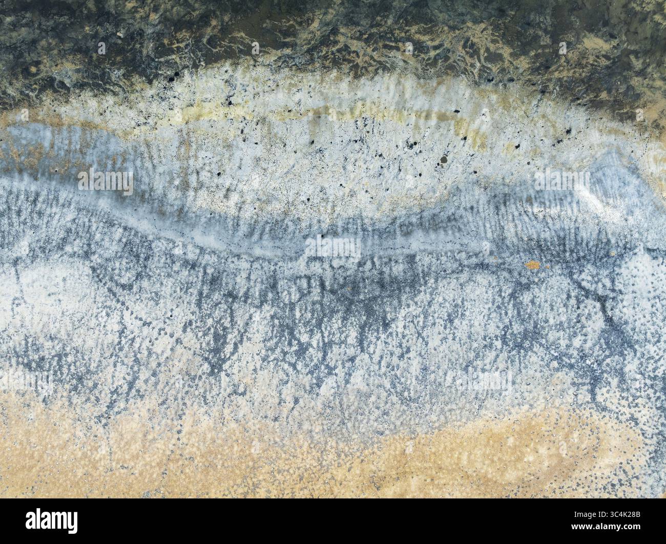 Aerial view of the Walvis Bay salt works showing the contrast of light ...