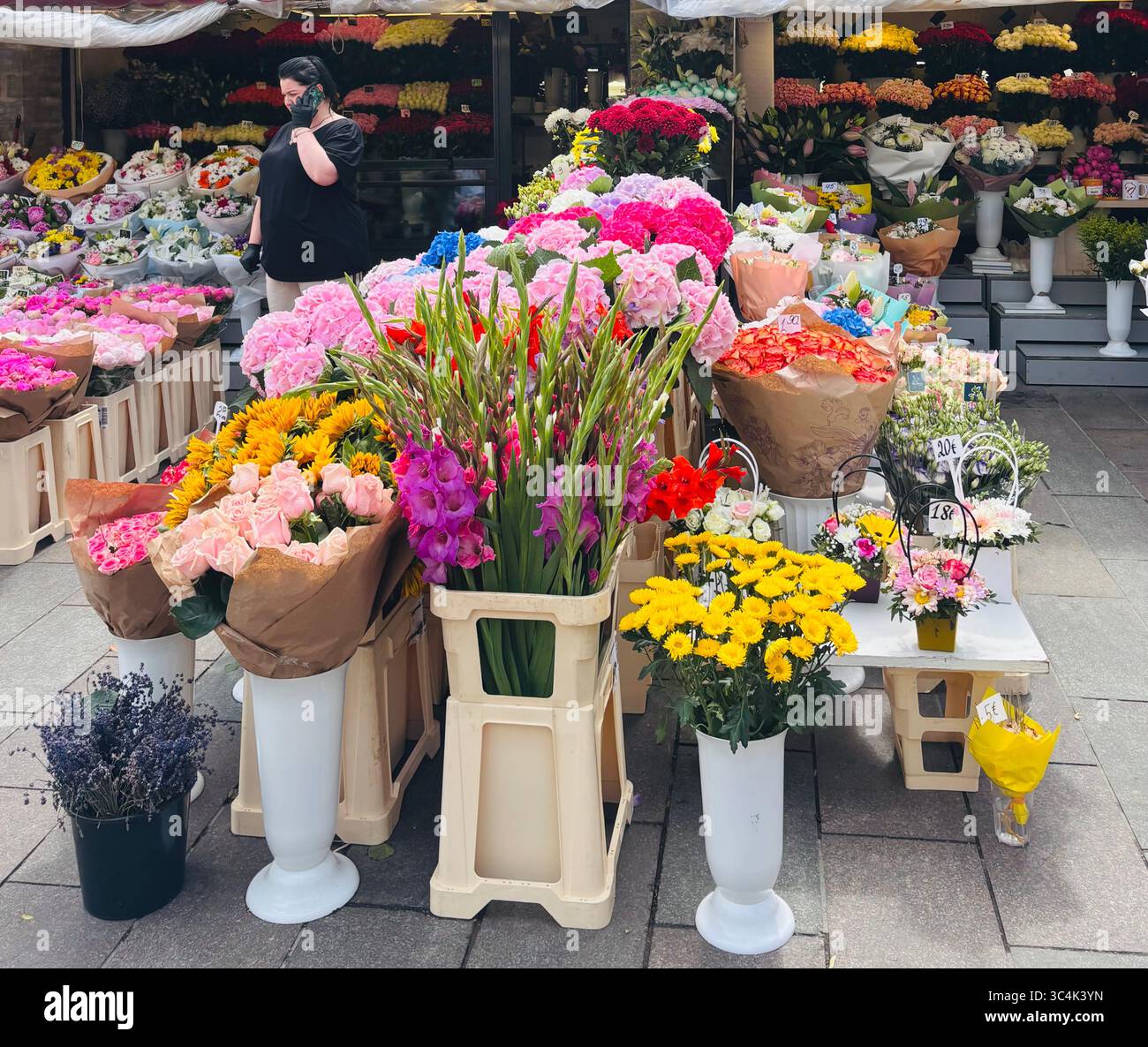 The colorful flower market outside Viru Gate in the old city of Tallinn, Estonia. - Smartphone Captured Stock Image
