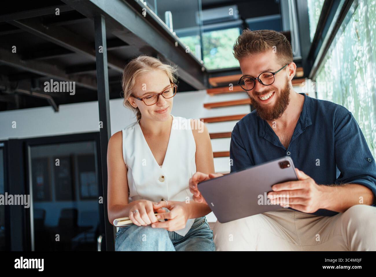 Engaging in Collaborative Work within a Modern Workspace that Utilizes CuttingEdge Technology Stock Photo