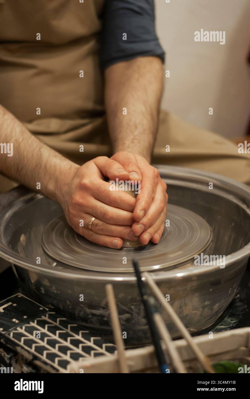 Making ceramic pot on traditional wheel Stock Photo