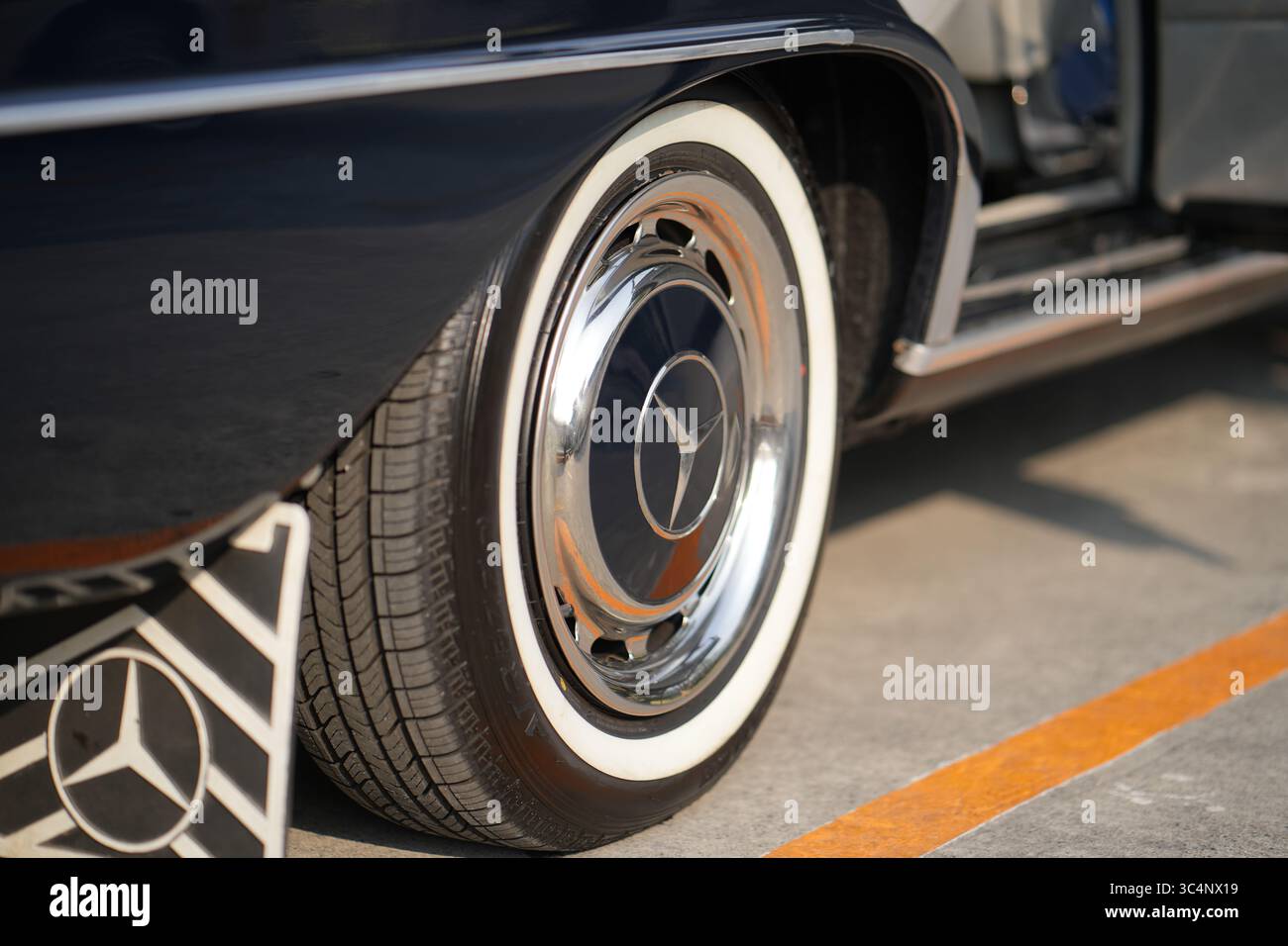 Bangkok, Thailand, 2 Feb 2025, Mercedes-Benz Vintage Wheels with Chrome Hubcaps, Whitewall Tires, and Clean Lines Emphasizing Iconic Star Emblem Repre Stock Photo
