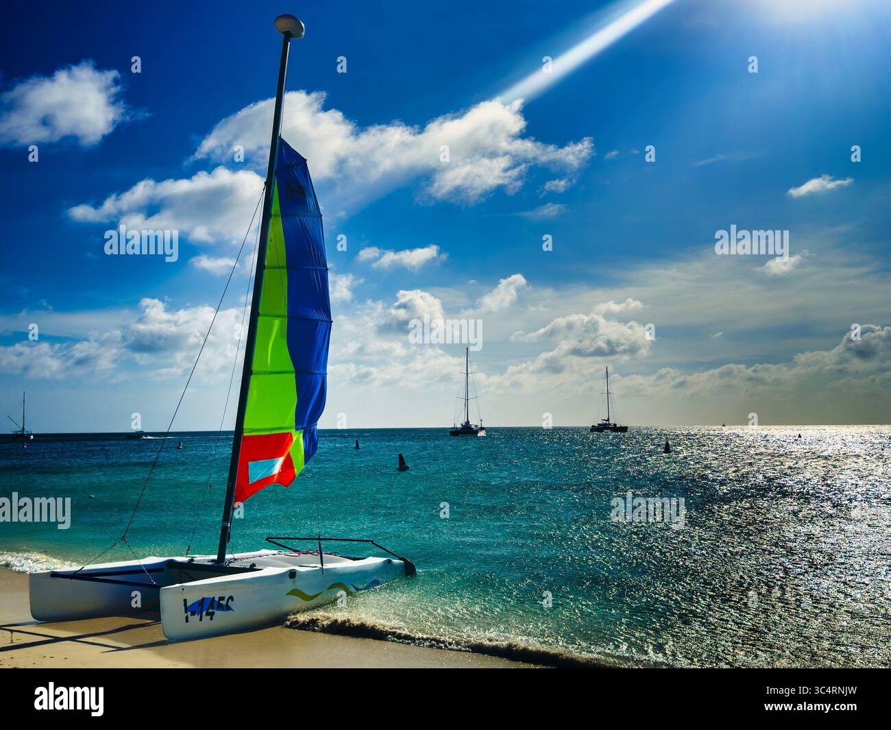 A tropical beach scene in the late afternoon. Stock Photo