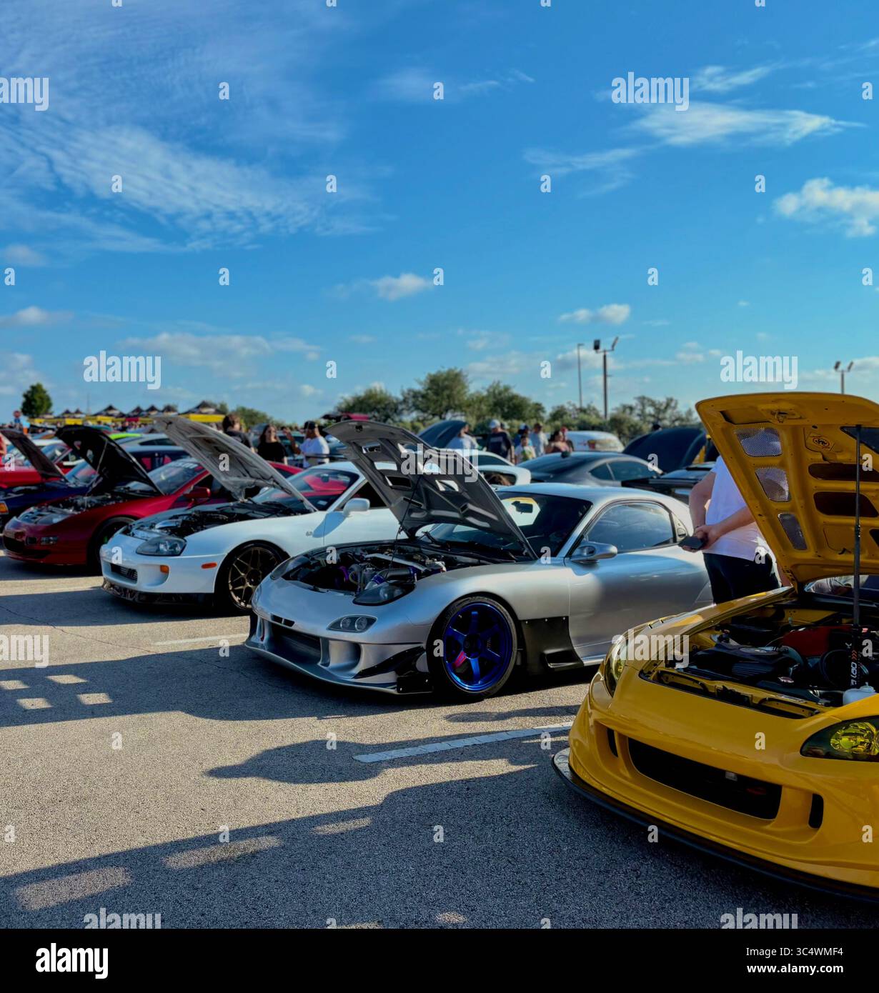Honda S2000 posing next to a silver Mazda RX-7 and Mk4 Toyota Supra - Smartphone Captured Stock Image Honda S2000 posing next to a silver Mazda RX-7 and Mk4 Toyota Supra - Smartphone Captured Stock Image