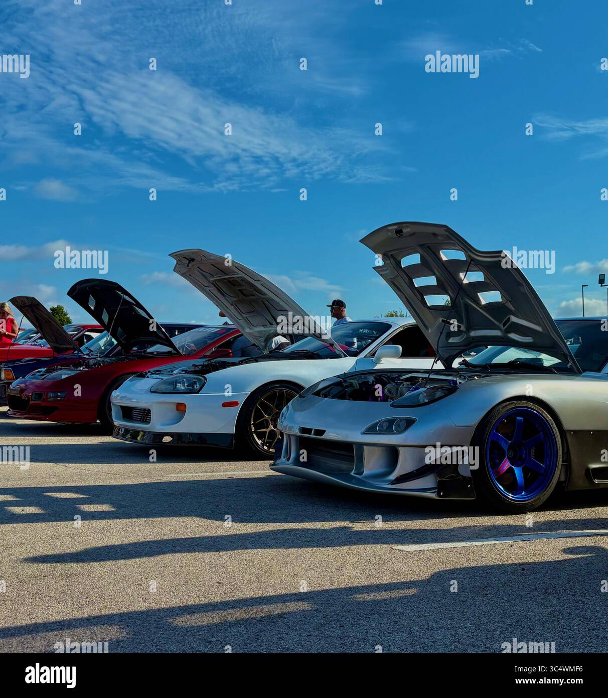 Honda S2000 posing next to a silver Mazda RX-7 and Mk4 Toyota Supra - Smartphone Captured Stock Image Honda S2000 posing next to a silver Mazda RX-7 and Mk4 Toyota Supra - Smartphone Captured Stock Image