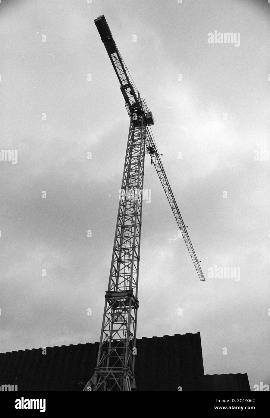 Crane towers over construction Black and White Stock Photos & Images ...
