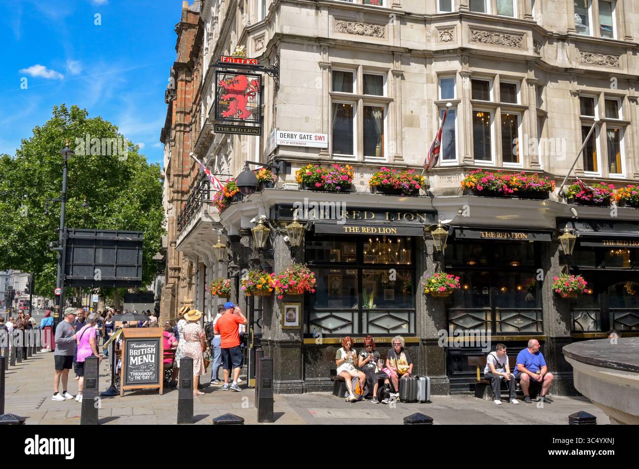 London, England, UK - 4 July 2025: People outside the Red Lion pub in Westminster. Stock Photo