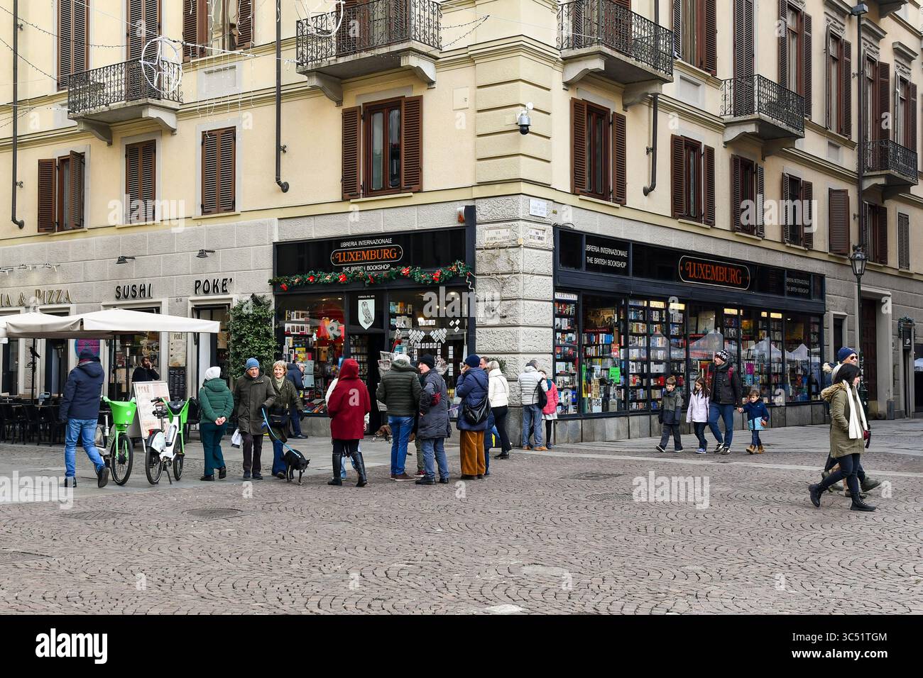 People strolling in front of the international bookstore Luxemburg, the oldest bookshop in the city, opened in 1872, Turin, Piedmont, Italy Stock Photo