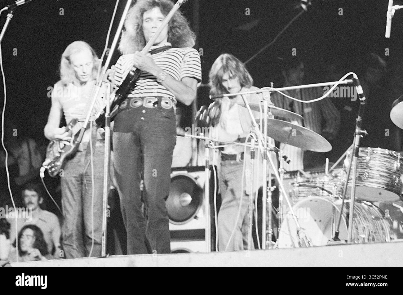Holland Pop Festival in the Kralingse bos, which has gone down in history as the Dutch version of the American Woodstock festival. With performances by The Byrds, Mungo Jerry, Canned Heat and Jefferson Airplane, Music, Rotterdam, 26-06-1970 Whizgle News, Dutch Desk, The Netherlands, 1950-2000 A dynamic rock band performs energetically on stage, showcasing their passion for music. The guitarist strikes a powerful pose while the drummer maintains rhythm, creating an atmosphere charged with excitement. Fans in the background enjoy the performance, immersed in the live experience. Stock Photo