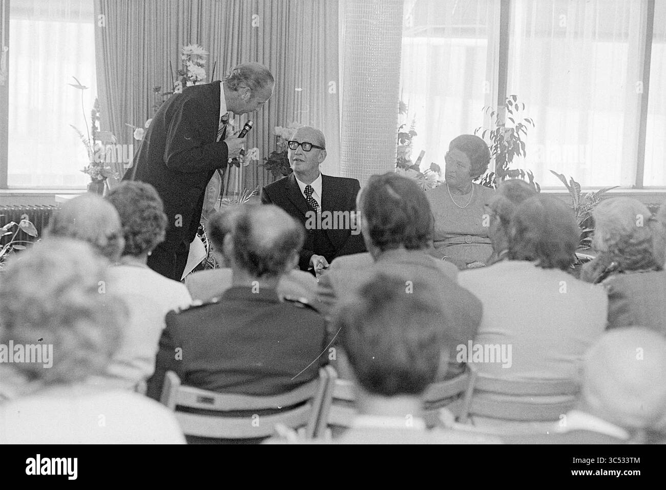 Woman welcoming man audience Black and White Stock Photos & Images - Alamy
