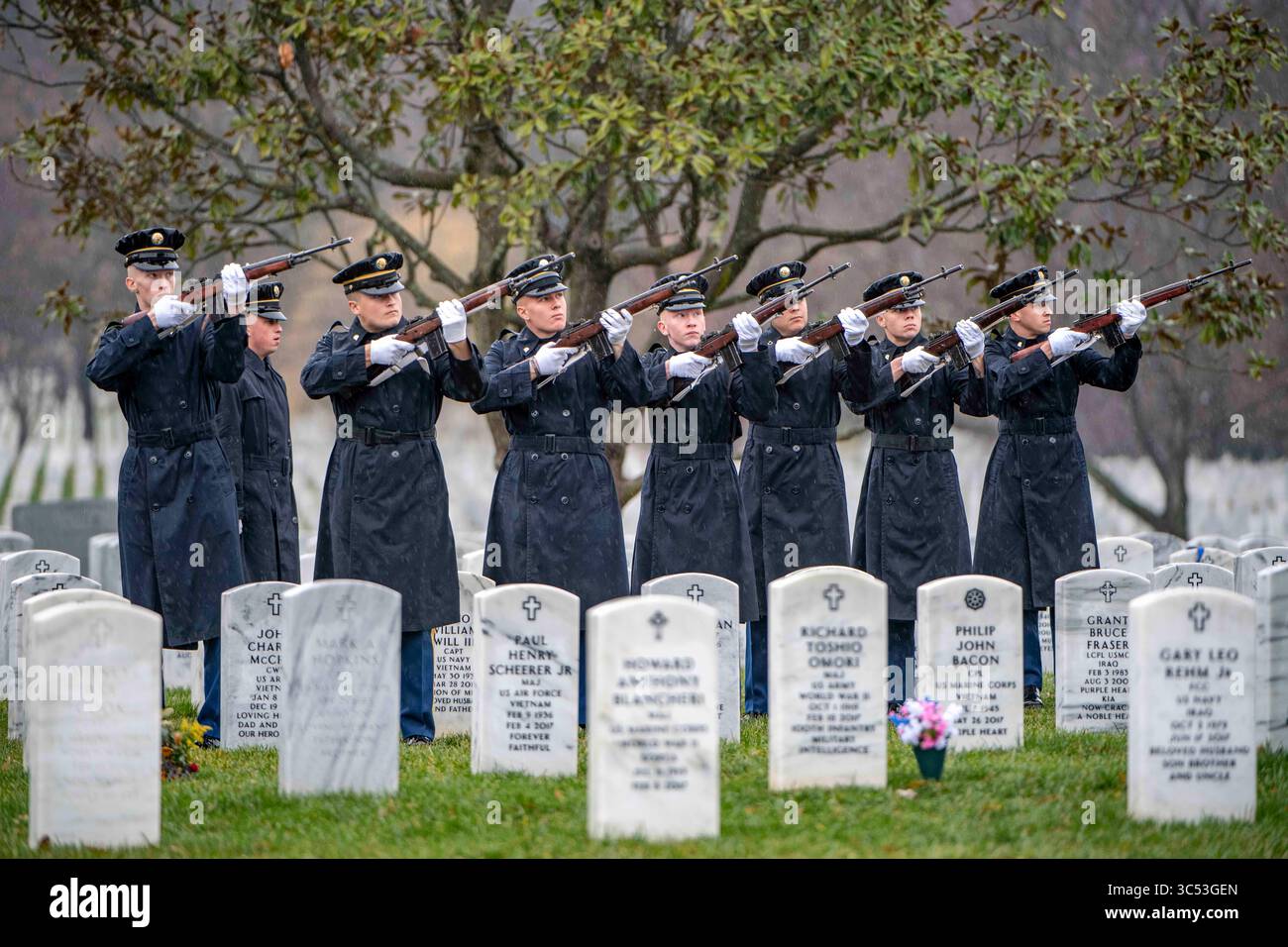 December 10, 2019 - Arlington, Virginia, United States - A firing party from the 3d U.S. Infantry Regiment (The Old Guard) fires 3-rifle volleys as part of military funeral honors for U.S. Army Cpl. Earl H. Markle in Section 60 of Arlington National Cemetery, Arlington, Virginia, Dec. 10, 2019. In November 1950, Markle was a member of Company M, 3rd Battalion, 8th Cavalry Regiment, 1st Cavalry Division. He was reported missing in action on Nov. 2, 1950, when his unit was attacked by enemy forces near Unsan, North Korea. His remains could not be recovered following the attack, and he was not re Stock Photo