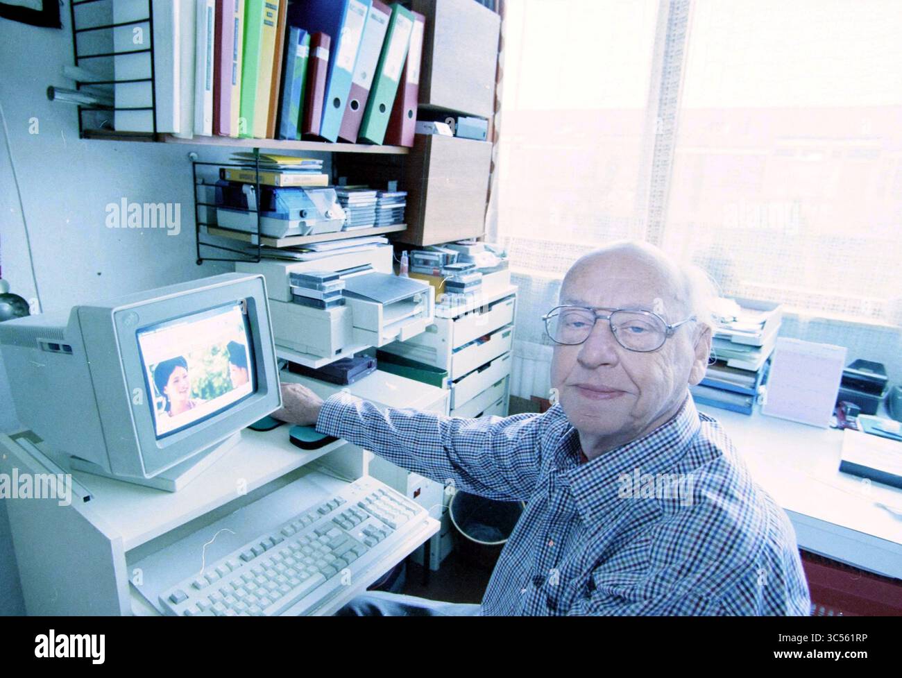 Behind Computer Screen Man sits desk behind computer screen hi-res stock photography and ...
