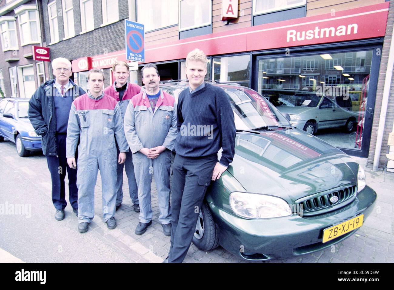 Group of men stands beside hi-res stock photography and images - Alamy