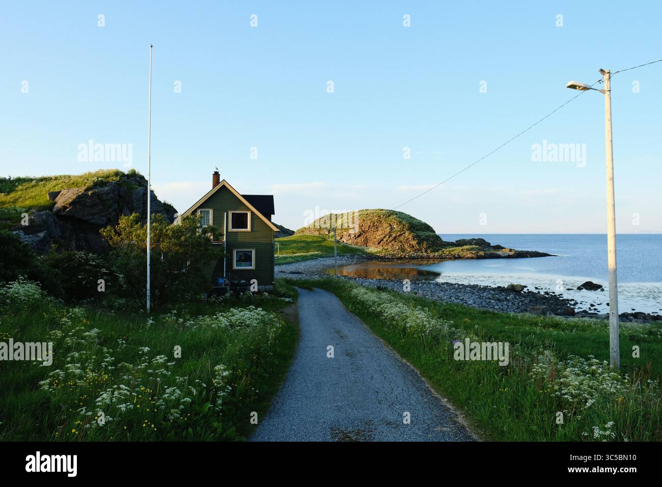 A small house next to the sea in the Værøy island, Norway Stock Photo ...