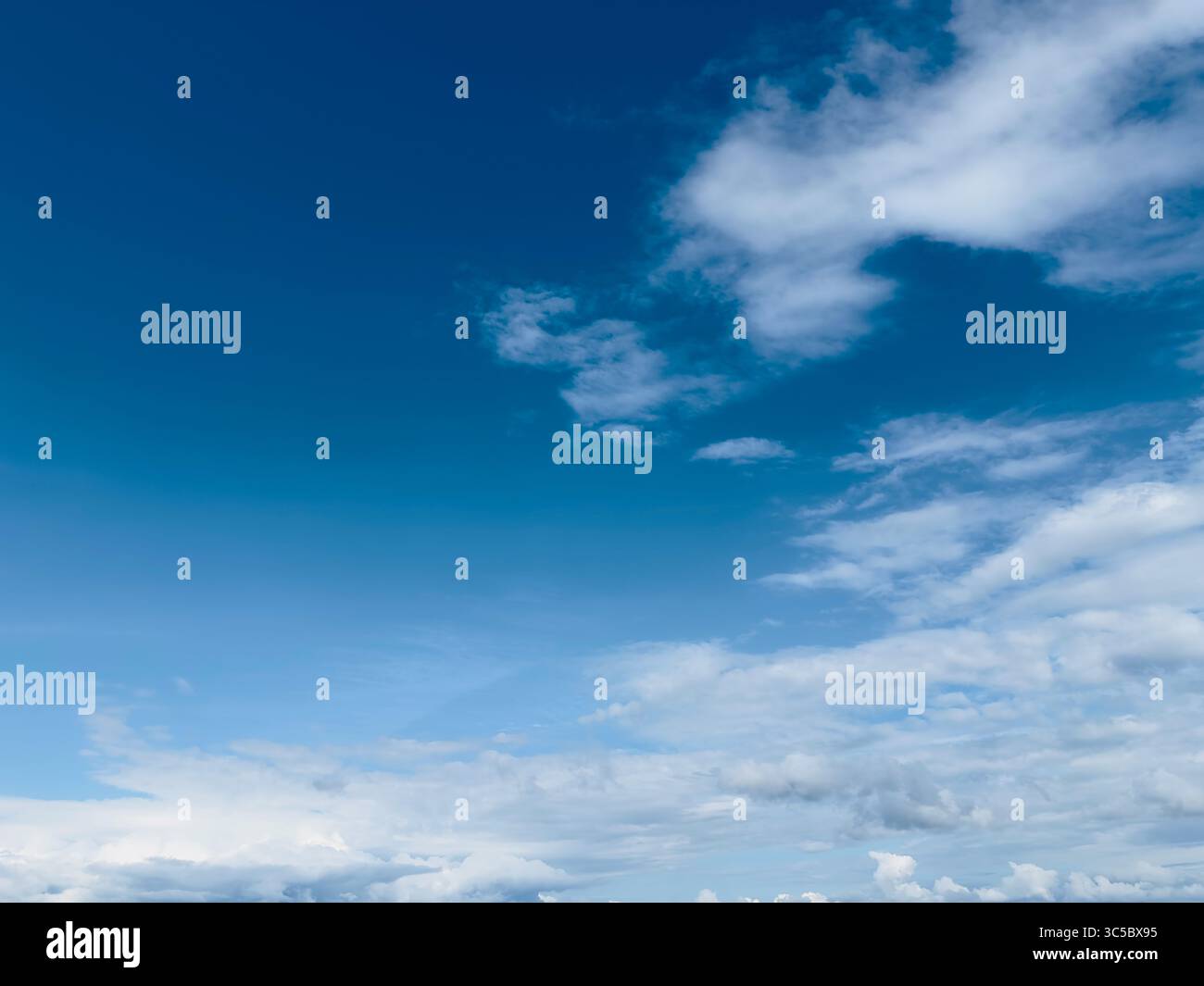 Stunning blue sky filled with puffy white clouds in a serene scene ...
