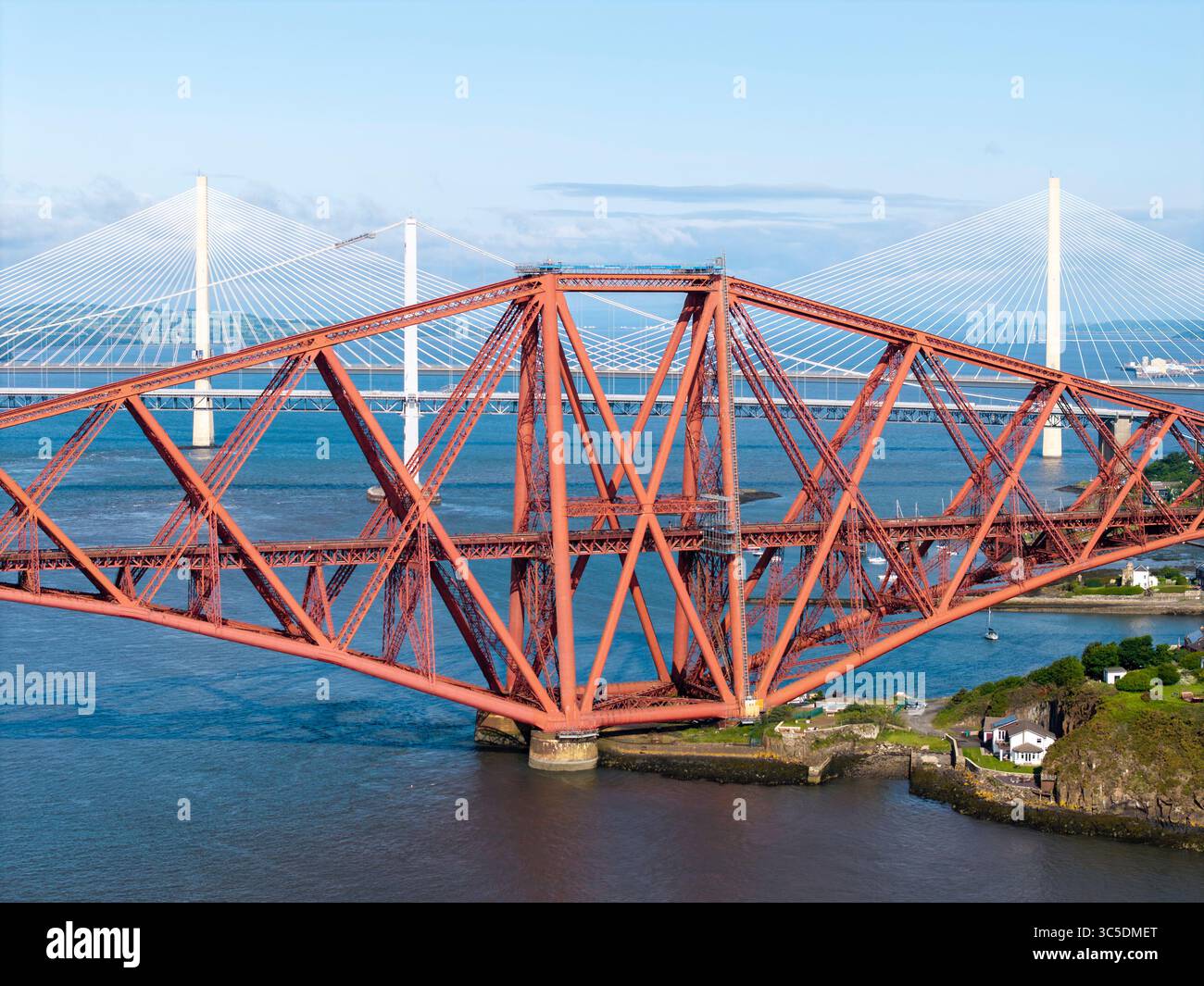 NORTH QUEENSFERRY, FIFE, SCOTLAND - JUNE 18, 2025: Aerial view, the Forth Rail Bridge, Firth of Forth and North Queensferry, Scotland Stock Photo