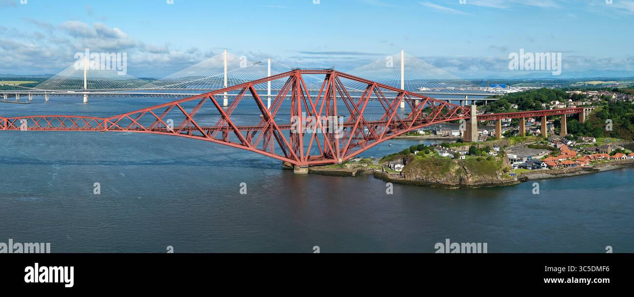 NORTH QUEENSFERRY, FIFE, SCOTLAND - JUNE 18, 2025: Aerial view of the Forth Bridge at North Queensferry, spanning the Firth of Forth Stock Photo