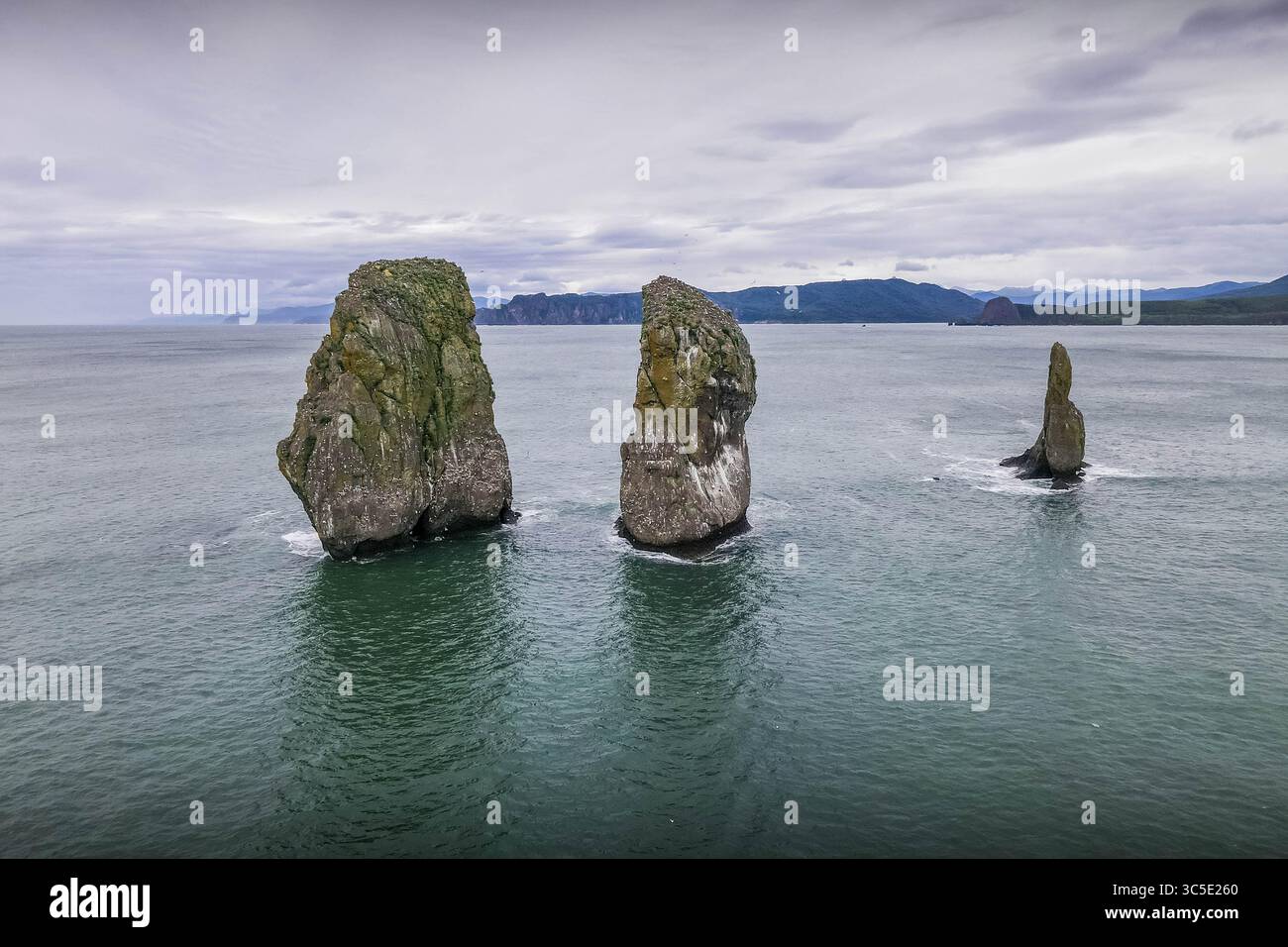 Aerial view of the Three Brothers rock formation in Kamchatka, rising ...