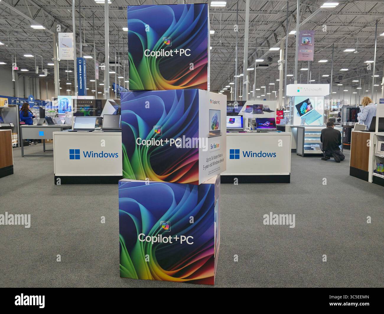 Pc Signage Microsoft Copilot+ PC signage is displayed along Windows PC laptops ...